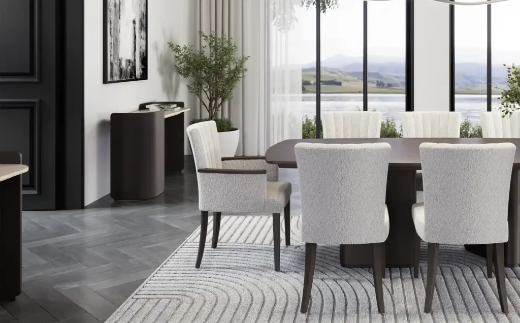 Adriana Hoyos dining room with white chairs and a table